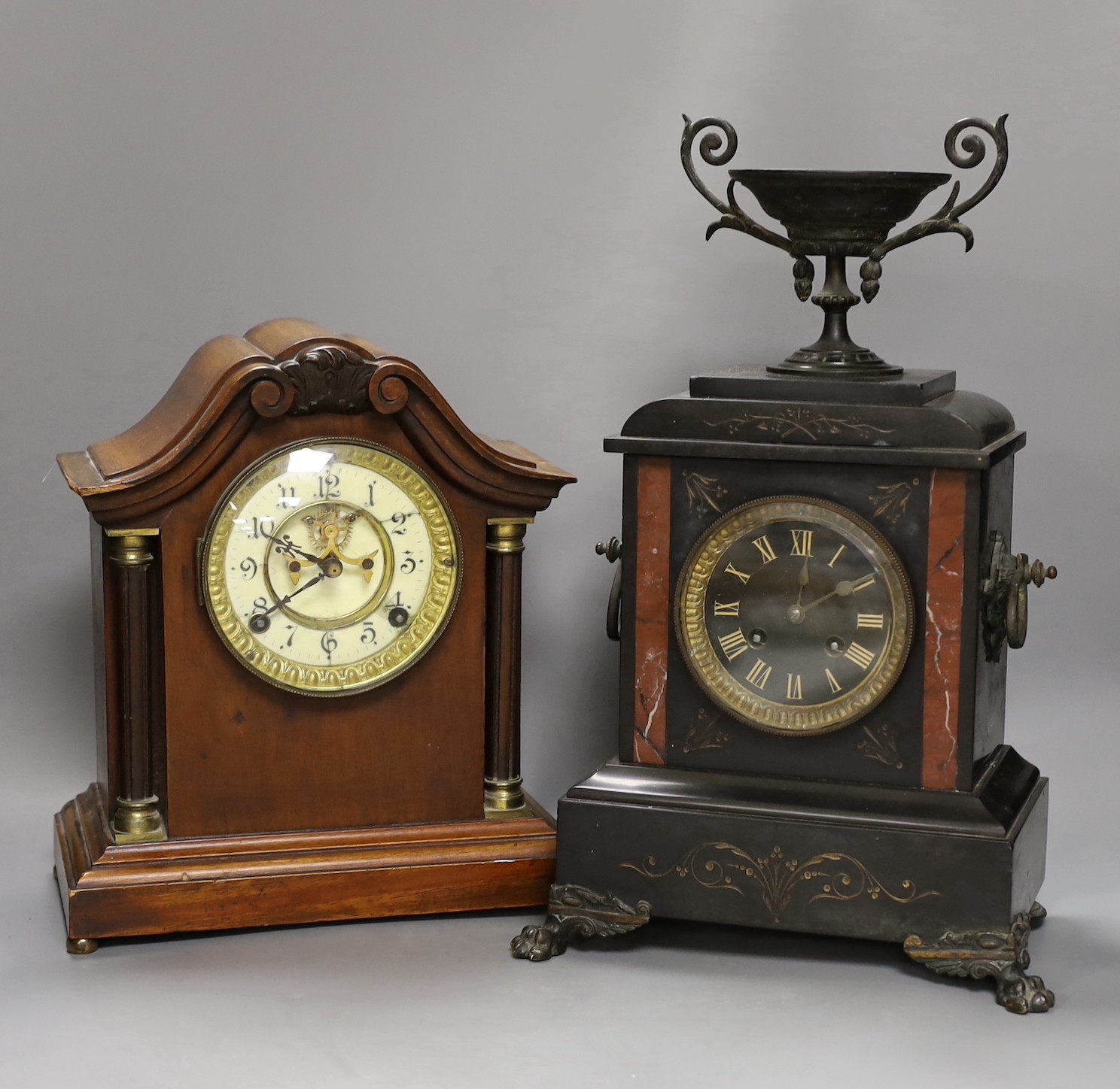 A 19th century slate urn mantel clock with lion feet, together with an American column mantle clock, tallest 41cm